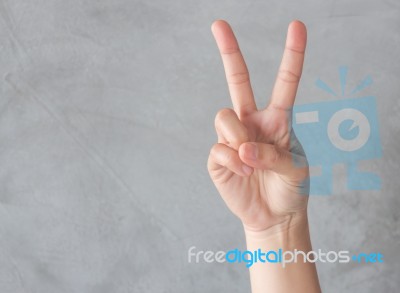 Hand Action Gesture On Grey Background Stock Photo