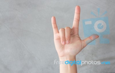 Hand Action Gesture On Grey Background Stock Photo