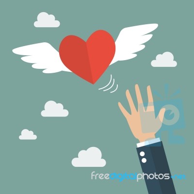 Hand Catching A Heart Flying Stock Image