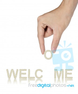 Hand fixing Welcome Word Stock Photo