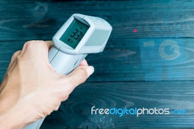 Hand Hold The Ir Thermometer Stock Photo