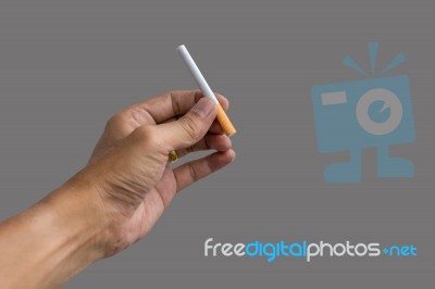 Hand Holding A Cigarette Stock Photo