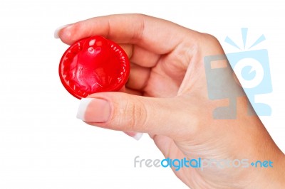 Hand Holding A Condom Stock Photo