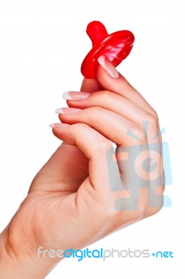 Hand Holding A Condom Stock Photo