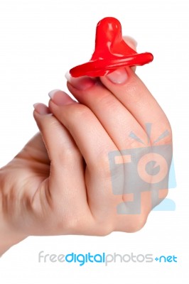 Hand Holding A Condom Stock Photo