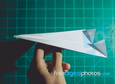 Hand Holding A Paper Airplane Engineering Background Stock Photo