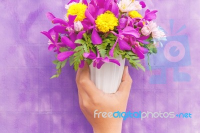 Hand Holding Bouquet Of Chrysanthemum And Orchid Flowers Isolate… Stock Photo