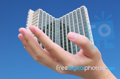 Hand Holding Building Stock Photo