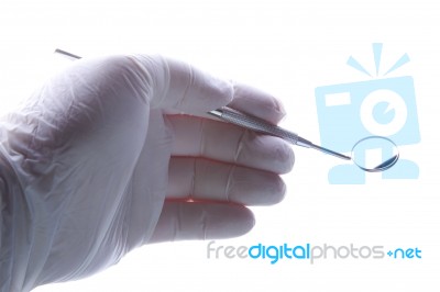 Hand Holding Dental Mirror Stock Photo