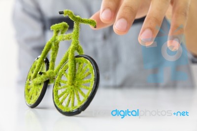 Hand Holding Eco Bicycle Stock Photo