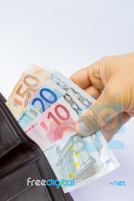 Hand Holding Euro Notes In Wallet Stock Photo