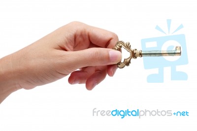 Hand Holding Golden Key Isolated On White Background Stock Photo