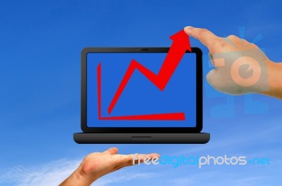 Hand Holding Laptop With Graph Stock Image