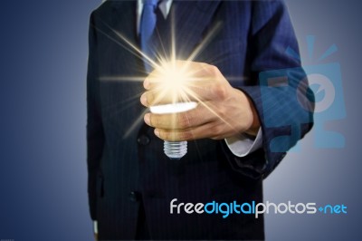 Hand Holding Light Bulb Stock Photo