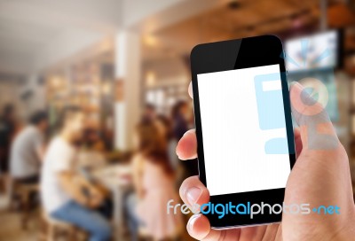 Hand Holding Phone On Coffee Cafe Background Stock Photo