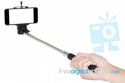 Hand Holding Phone Selfie Stick Isolated With Clipping Path Stock Photo