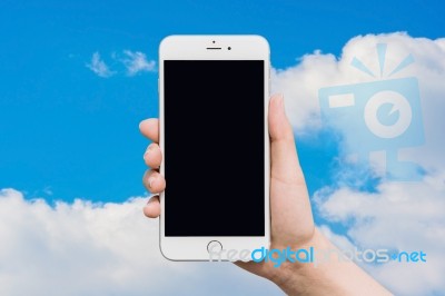 Hand Holding Smart Phone On Background Stock Photo