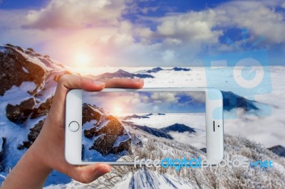 Hand Holding Smart Phone Take A Photo At Deogyusan Mountains In Winter Stock Photo