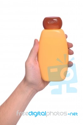 Hand Holding Sun Lotion Stock Photo