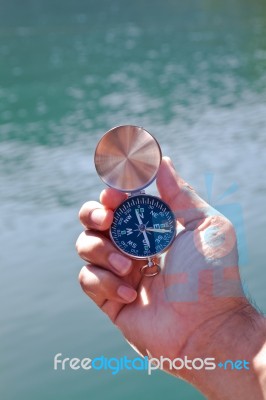 Hand Holding The Black Compass Stock Photo