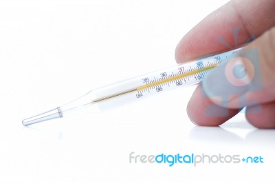 Hand Holding Thermometer Stock Photo