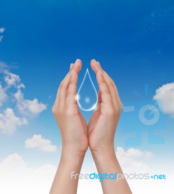 Hand Holding Water Drop Stock Photo