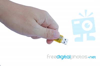 Hand Holding Yellow Flashdrive Stock Photo