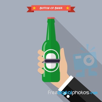 Hand Holds A Bottle Of Beer Stock Image