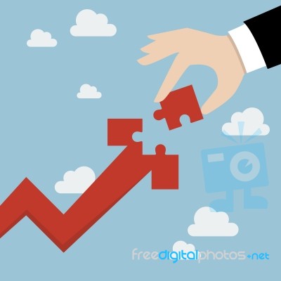 Hand Inserts The Missing Puzzle In Arrow Graph Up Stock Image