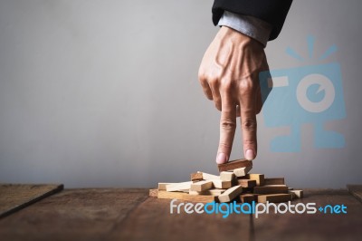 Hand Liken Business Person Stepping Up A Toy Wooden Block To Goa… Stock Photo