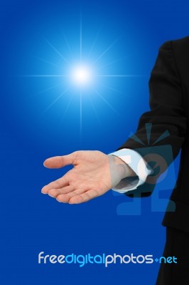 Hand Of Business Man Give Light Of Chance Stock Photo