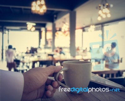 Hand Of Business Man Holding Coffee Cup Stock Photo