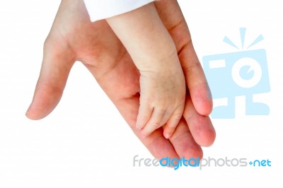 Hand Of Mother With Arm Of Baby On Black Stock Photo