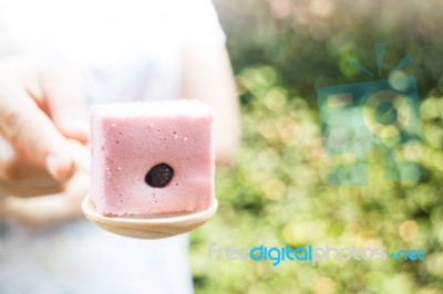 Hand On Serving Thai Steamed Cotton Cake Stock Photo