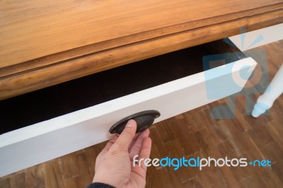 Hand Open Drawer Box Of Wooden Table Stock Photo