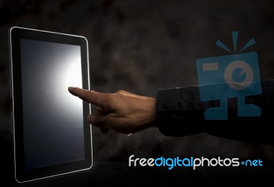 Hand Point To Touching On Tablet Screen Stock Photo