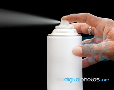 Hand Press Spray Bottle On Black Background Stock Photo