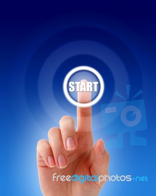 Hand Pressing A Start Button Stock Photo