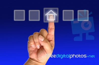 Hand Pushing The Button House Stock Photo