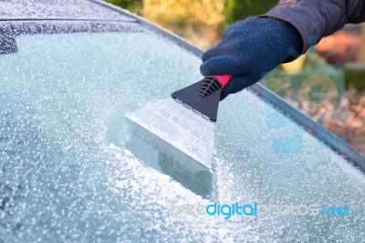 Hand Scratching Ice From Car Window Stock Photo