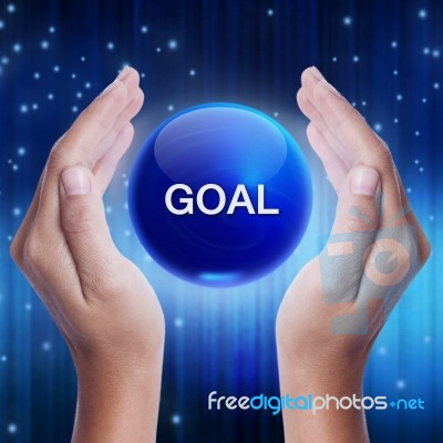 Hand Showing Blue Crystal Ball With Goal Word Stock Photo