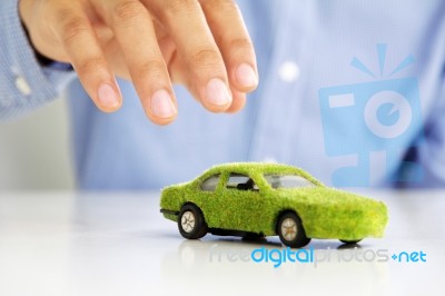 hand taking Eco Car Icon Stock Photo