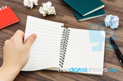 Hand Tearing Paper From Notebook Stock Photo