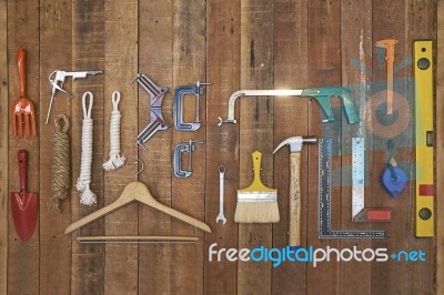 Hand Tools And Equipments Hang On Vertical Stripe Wood Board Stock Photo