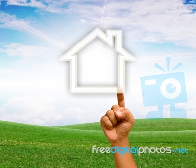 Hand Touching House Icon Stock Photo