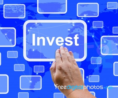 Hand Touching Invest Button Stock Photo