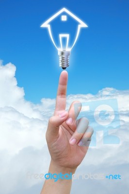 Hand Touching Light Bulb Stock Photo