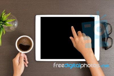 Hand Use White Tablet On Desk Table Top View Stock Photo