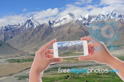 Hand Using Smartphone Photographed Snow Peak Mountain View Backg… Stock Photo