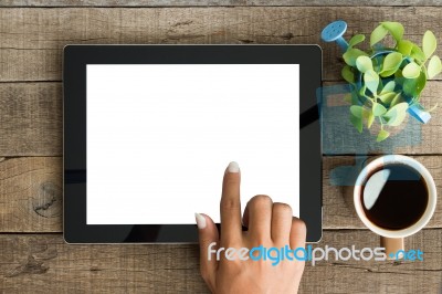 Hand Using Tablet On Top View Stock Photo